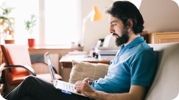 Man working on laptop at home